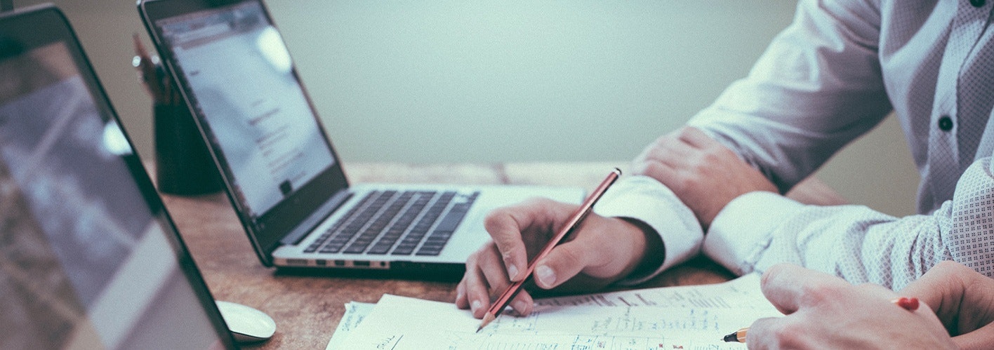 marketer taking notes from his computer